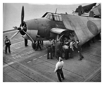 Avenger (’4H’) of 850 Sqdn is moved by hand off the forward elevator onto  the flight deck of HMS Empress February 17th 1944.Photo:   CFB Esquimalt Naval & Military  Museum, VR995.30.15